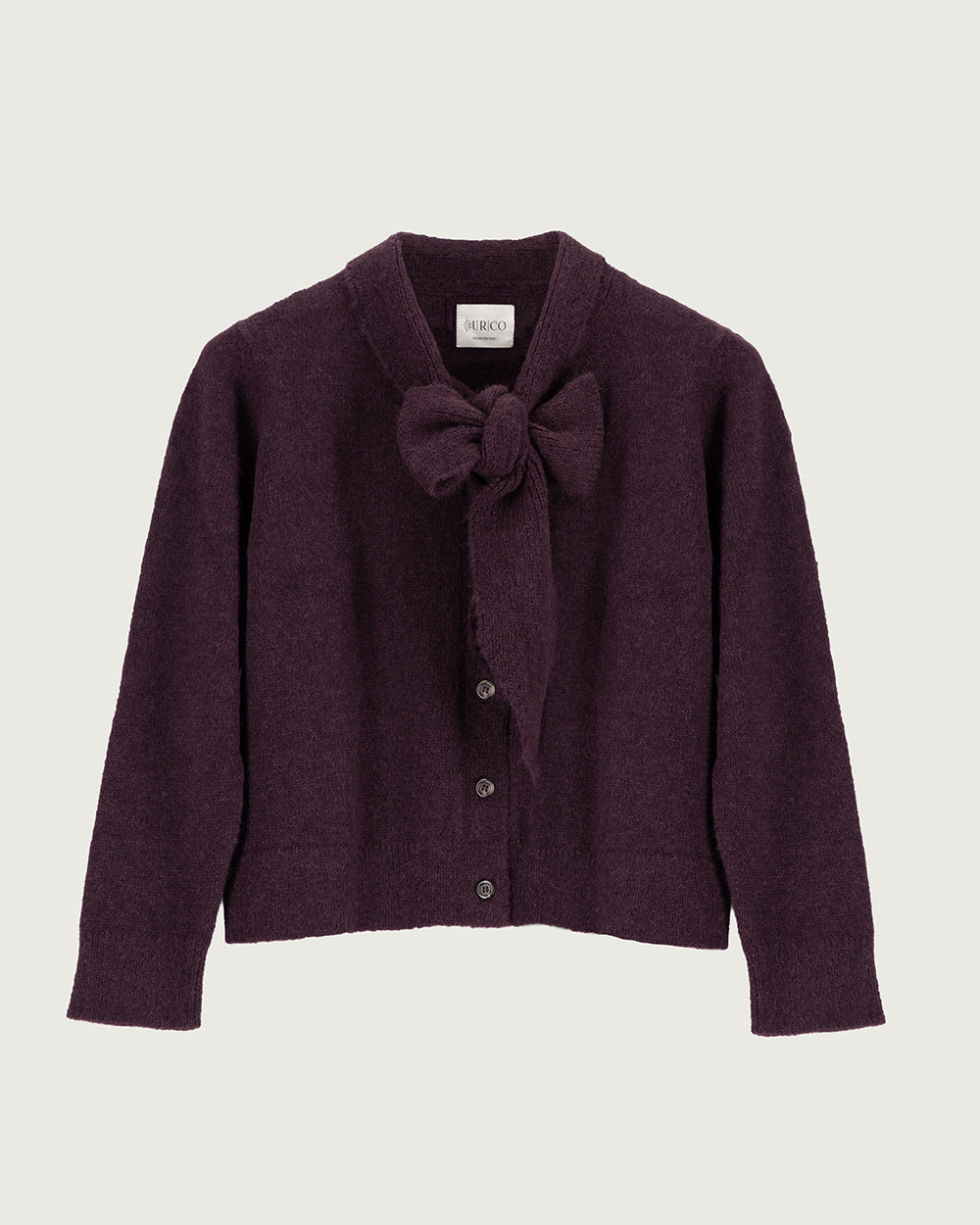 Chaleco de lana de alpaca premium Melyon color burdeo vino de la colección Her Story, de silueta fluida con lazo de cinta en el cuello y cierre de botones de moda ética urco.